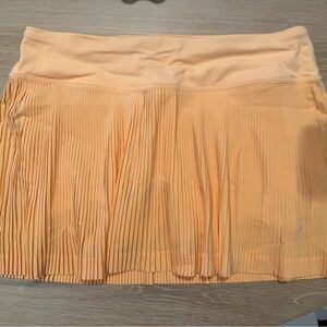 Lululemon Athletica Pleat to Street tennis skirt in Summer Glow, NEW WITHOUT TAG